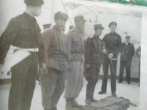 HMS Belfast with captured North Korean prisoners