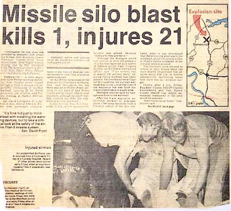 Newspaper article including a photo of Greg being carried into hospital 